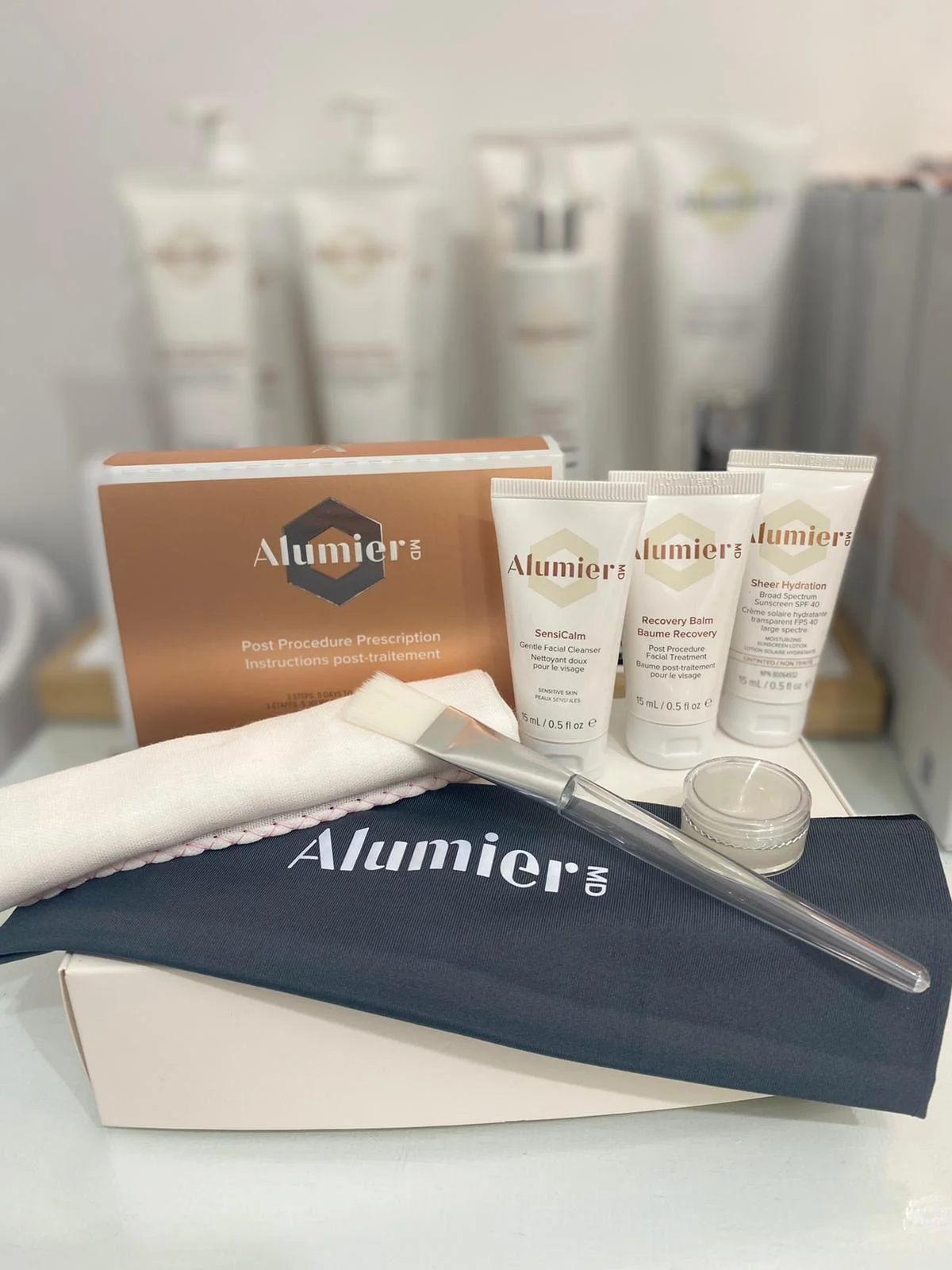 The complimentary AlumierMD aftercare kit included with the Radiant Glow peel — SensiCalm cleanser, Recovery Balm and Sheer Hydration SPF 40