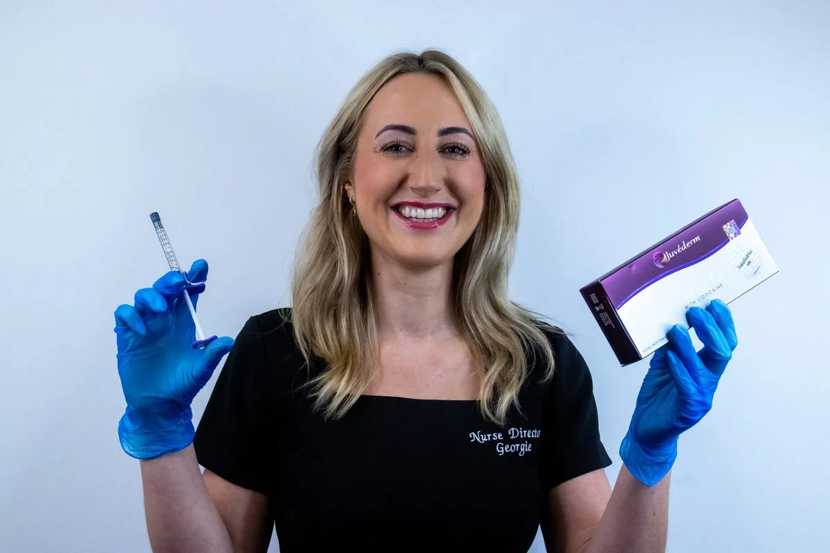 Georgie, Nurse Director at LUMOS Clinic Basingstoke, holding Juvéderm Volift filler and a syringe
